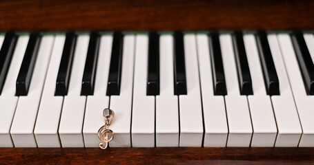 Piano keys and treble clef. Concept close-up