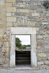 Door in an old historical wall. Courtyard.