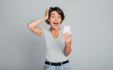 Close up photo of screaming from good news girl with nice short hairstyle and perfect skin in front...