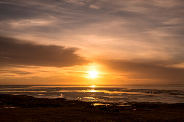 Sunset on iceland beach with beautiful sky