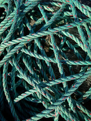Close shot of a fishing net and ropes. Fishing net and rope background