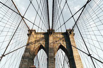 Iconic Brooklyn Bridge cables and pillars