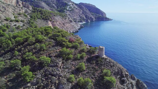 Seaside cliffs and medieval towers. Aerial view. Mediterranean Sea. Spain.
