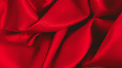 Smooth elegant red silk or satin luxury cloth texture can use as abstract background. Luxurious fabric background design