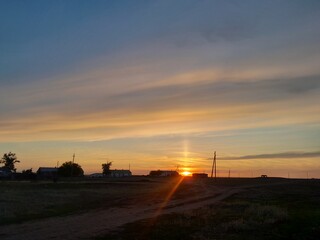 Beautiful sunset - view of an village . High quality photo. Beautiful nature, sky. High quality photo