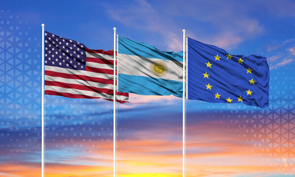   Three realistic flags of European Union, USA (United States of America)and Argentina on flagpoles and blue sky.