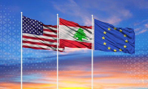 Three realistic flags of European Union, United States and Lebanon on flagpoles and blue sky.