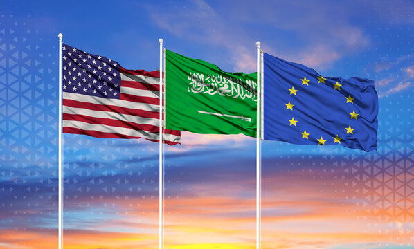 Three realistic flags of European Union, United States and Saudi Arabia on flagpoles and blue sky.