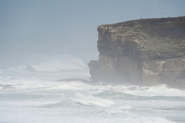 Strong waves breaking on the cliffs of Galizano in Cantabria