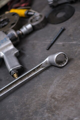 Fototapeta premium Industrial hand tool, parts and hand tools lying on the metal stand in the factory.
