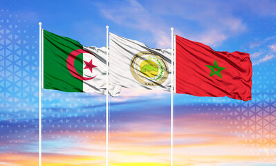 flags of morocco, algeria and Arab Maghreb Union.on flagpoles and blue sky