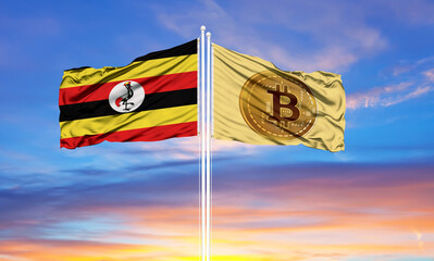 Bitcoin and Uganda two flags on flagpoles and blue sky.