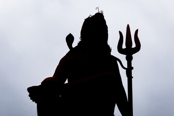 backlit isolated shot of hindu god shiva with white background