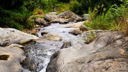 Waterfall and rocks landscape view
