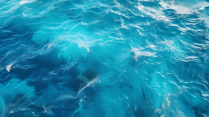 Fototapeta na wymiar Top view of turquoise sea surface with ripples and waves