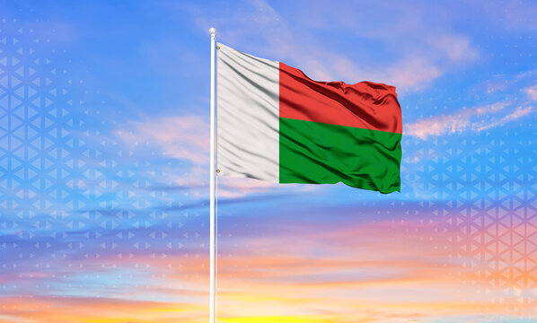 Madagascar flag waving in the wind against white cloudy blue sky   Diplomacy concept, international relations