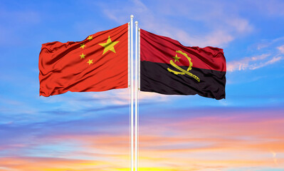 Flag of China and angola waving in the wind against white cloudy blue sky together. Diplomacy concept, international relations