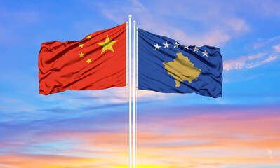 China and kosovo two flags on flagpoles and blue cloudy sky . Diplomacy concept, international relations