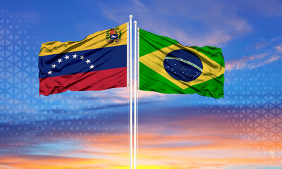 Venezuela and Brazil two flags on flagpoles and blue sky
