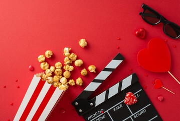 Cinematic Love Symphony: Overhead composition featuring slate, 3D glasses, spilled popcorn,...