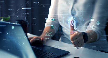 Obraz na płótnie Canvas Using fingerprint indentification to personal access. Biometrics security, E-kyc, innovation technology concept. 