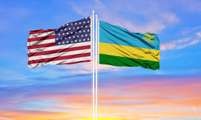 United States and Rwanda two flags on flagpoles and blue cloudy sky . Diplomacy concept, international relations