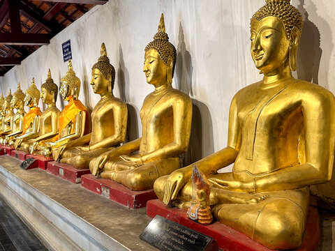 group of golden Buddha statues at Wat Phra Si Ratana Mahathat Woramahawihan, Phitsanulok, Thailand