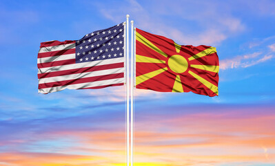 United States and North Macedonia two flags on flagpoles and blue cloudy sky . Diplomacy concept, international relations