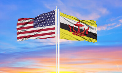 United States and Brunei two flags on flagpoles and blue cloudy sky . Diplomacy concept, international relations