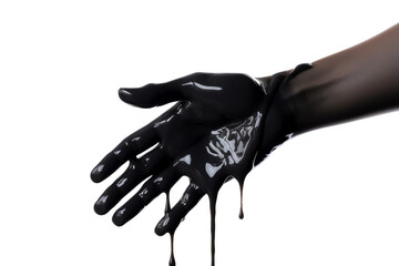 close up of black paint dripping from hand on white background with clipping path