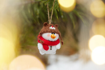 toy snowman on snow on the christmas