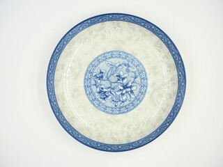 Empty ceramic round plate on top view isolated on white background,Ceramic plate with flower patter,Oriental porcelain