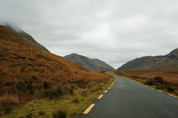 Connemara National Park in Ireland. Scenic drive on N59 route stretches beside the calm ocean water...