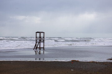 Strong autumn storm, rough sea, beach in Italy