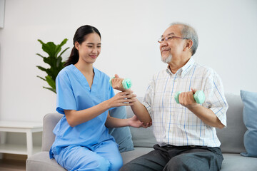 nurse or caregiver helping elderly patient to physiotherapist and exercise for rehabilitation at home