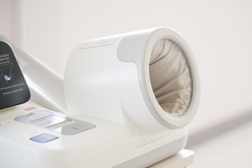 Empty medical digital blood pressure monitor automatic arm insert at outpatient department for...