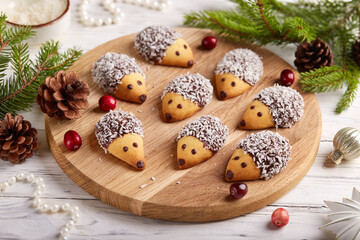 Cookies in a shape of hedgehogs with chocolate and coconut flakes. Delicious homemade dessert