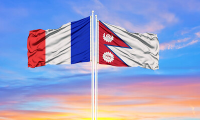 france and Nepal two flags on flagpoles and blue cloudy sky . Diplomacy concept, international relations