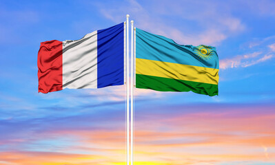 france and Rwanda two flags on flagpoles and blue cloudy sky . Diplomacy concept, international relations