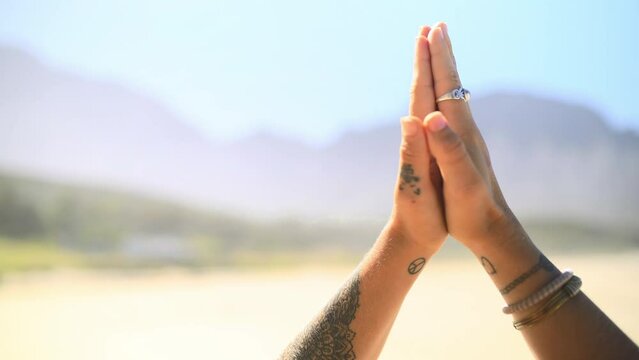 Hands, beach and closeup of woman praying for a meditation exercise for zen, health and wellness. Calm, spiritual and zoom of female person in namaste yoga pose for mindfulness and body balance.