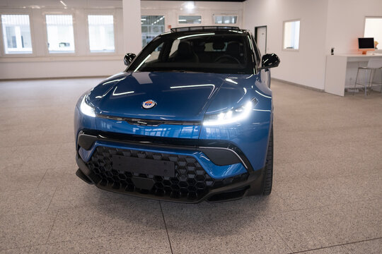new blue electric Fisker Ocean car in showroom, Dual Motor AWD, trends EV, technological advancements automotive industry, environmental cleanliness vehicle, Frankfurt, Germany - December 8, 2023
