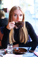 Female Outdoor Cafe Portrait with cup of coffee