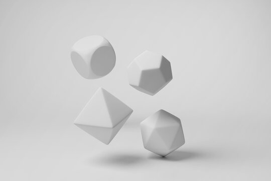 White game dice having different number of faces floating in mid air on white background in monochrome and minimalism. Illustration of the concept of desktop board games