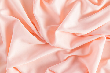 Beautiful abstract peach color background of soft factory fabric. Abstract background. Layout for...