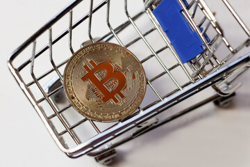 Bitcoin in shopping cart, business concept