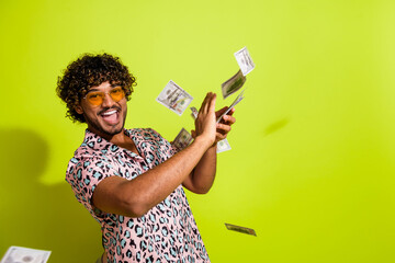 Photo portrait of attractive young man throw banknotes wear trendy pink leopard print clothes...