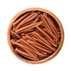 Casarecce pasta in a wooden bowl. Gluten free pasta, made with the flour of red lentils,  chickpeas and rice. Short twists of pasta originating from Sicily which appear rolled up on themselves. Photo.