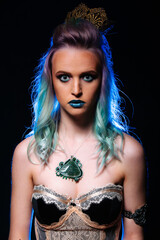A woman with blue hair wearing a corset. A Woman With Blue Hair Wearing a Corset