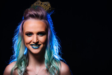 A woman with blue hair and a crown on her head. Blue-Haired Woman with a Crown