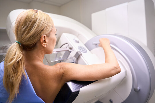 Adult female patient receiving 3D mammography in clinic